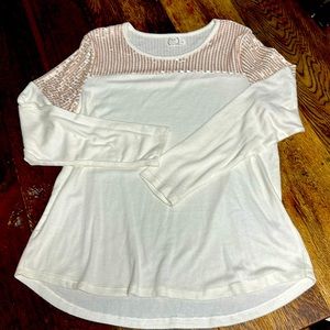 Women’s Long sleeve with sequin at the top. Size large. Never worn.